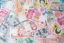 Flat Lay Design Of Various International Banknote Include Dollar Yuan Baht Won For Currency Exchange And Forex Trading Concept.