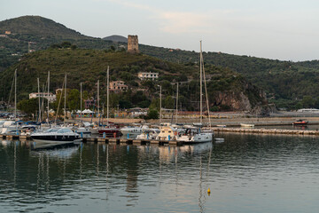 Wall Mural - View of Marina di Camerota port and waterfront at sunset, Campania, Italy