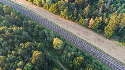 Train tracks through German forest near Munich aerial drone view fotage