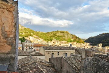 Canvas Print - Residential area of Modica, Sicily in Italy, with old houses built on hillside. Sicilian heritage