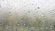 panoramic background - raindrops and trickles of rain close up on window glass in heavy rain