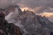 © robertharding - Sunset light above Tofane with some low clouds hanging between rocks, Dolomites, Italy
