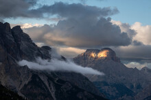 Sunset With Clouds On Croda Rossa D'Ampezzo In The Dolomites With A Single Beam Of Light On The Rock, Dolomites, Italy