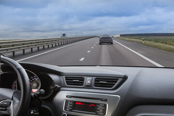 Poster - View from the car on a suburban highway