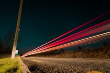 Low Angle Of Traffic Lights At Night Shot In Long Exposure