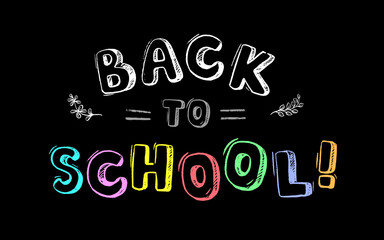 Wall Mural - The inscription in colored chalk on the blackboard - back to school!