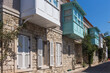 View of old, historical, traditional stone houses in famous, touristic Aegean town called Alacati. It is a village of Cesme, Turkey. It is a sunny summer day