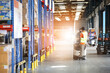 © sittinan - Portrait of worker in warehouse , they  happy and  working at The Warehouse. Storehouse area, Shipment.  warehouse worker unloading pallet goods in warehouse
