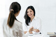© PaeGAG - Confident focused businesswoman, teacher or mentor coach speaking to business people at negotiations, woman leader speaker applicant talking at meeting or convincing hr during job interview concept