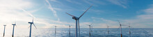 Wind Turbines. Offshore Wind Farm At Dusk. Renewable Power Concept.