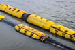 Floating old dredging pipes on the river close up