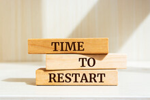 Wooden Blocks With Words 'TIME TO RESTART'.