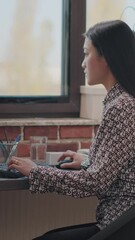 Poster - vertical video: asian woman using computer to plan business strategy in startup office. company empl