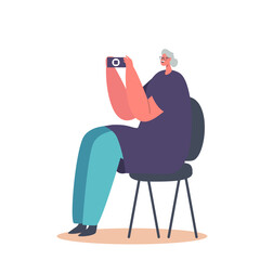 Wall Mural - Old Woman Use Mobile Phone. Elderly Lady Sitting on Chair Take Pictures, Communicate in Social Networks