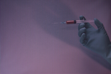 Poster - Beautiful hand holding creative syringe with red vaccine in the neon light.  Macro  photography view. Close-up of pixel.