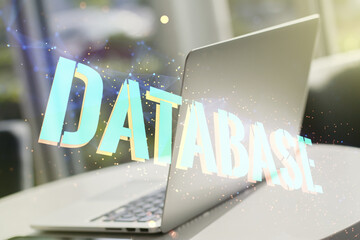 Poster - Double exposure of Database word sign on laptop background, global research and analytics concept
