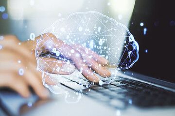 Aufkleber - Creative artificial Intelligence concept with human brain hologram and hands typing on laptop on background. Multiexposure