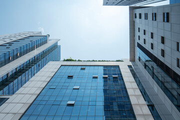Leinwandbilder - Looking Up Blue Modern Office Building