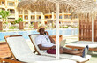 © ADDICTIVE STOCK - Black man having phone call on resort