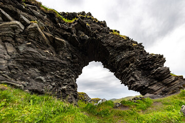 Wall Mural - Natural arch in the Rock Kirkeporten. Mageroya island, Skarsvag, Northern Norway