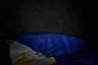 cute dark image of Philippines flag with big folds on black stone with free place for your text - any feast flag 3d illustration..