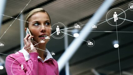 Poster - Animation of network of connections with icons over caucasian businesswoman talking on smartphone