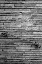 Sandstone Brick Wall With A Stairway Railing In Black And White, 