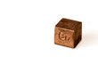 Copper cube with element name Cu on it on white background