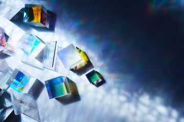 Geometric figures prisms with light diffraction of spectrum colors and reflection with trendy light