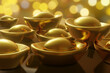 Chinese gold ingot currency (named as sycee or yuanbao) on bokeh background. Illustration of wealth and prosperity