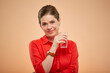 Smiling young lady in red shirt holding water glass isolated portrait.