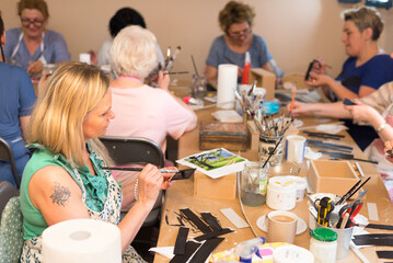 Wall Mural - Women in art workshop making decoupage boxes