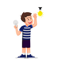 boy replaces a broken light bulb with a new one