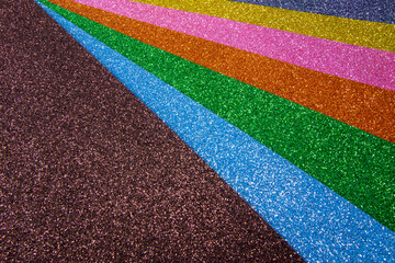 Wall Mural - rainbow glitter texture background.multicolored rainbow glitter background.
