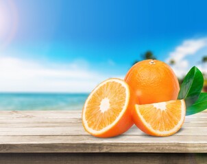 Poster - Orange with cut in half and leaves on the desk