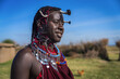 Leinwandbild Motiv Portrait of Maasai mara man with traditional colorful necklace and clothing