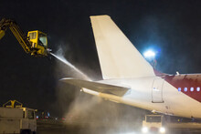 Ground Deicing Of The Tail Section Of A Passenger Aircraft At Night