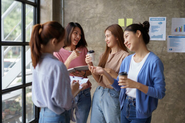 Wall Mural - Charming and creative young Asian businesswomen meeting to plan a meeting together marketing strategies, sales strategies to expand the business.