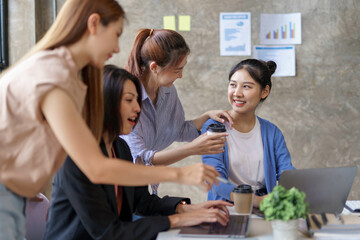 Wall Mural - Charming and creative young Asian businesswomen meeting to plan a meeting together marketing strategies, sales strategies to expand the business.