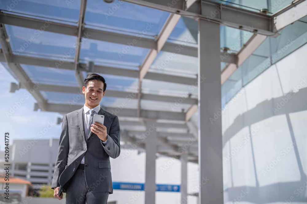 Businessman with smartphone walking against street blurred building background, Fashion business photo of beautiful girl in casual suite with smart phone.