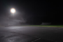 Spooky Night Scene Of Truck In Foggy Misty Parking Lot At Night Near High School Rafters