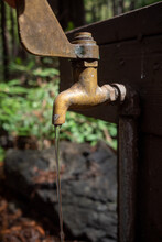 Water Drips From A Campground Spigot On A Faucet