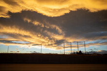 Dramatic Unusual Looking Storm Clouds Form At Sunset Over Telephone Poles