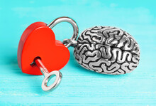 Steel Brain Attached To A Heart-shaped Padlock