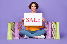 Portrait Of Attractive Cheerful Girl Holding Sale Board Presentation Announce Isolated Over Violet Lilac Color Background