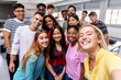 © Xavier Lorenzo - United multiracial big group of student friends taking selfie with teacher at college - Teenage high school people having fun together in classroom - Youth lifestyle, education and community concept