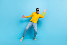Full Length Photo Of Funky Pretty Man Wear Yellow Sweater Dark Glasses Dancing Isolated Blue Color Background