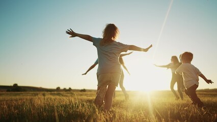 kids run in the park at sunset. friendly family children camp kid dream concept. a group of children