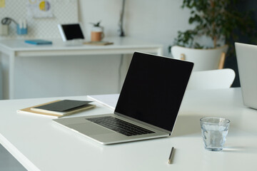 Close-up of workplace of business person with laptop for online work at office