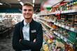 © Jacob Lund - Young grocery store worker